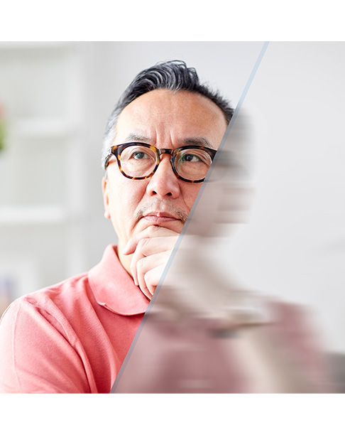 Asian man looking forward with an illustrated diagonal line blurring half the image